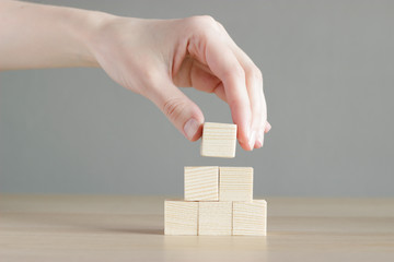 wood blocks on wood table with gray background