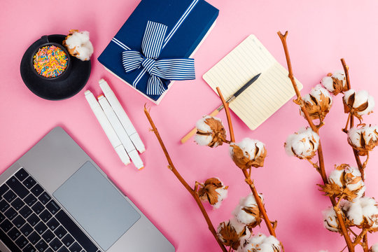 Work computer on a pink background top view. Flat lay. Minimal concept.
