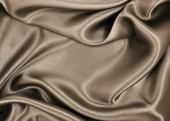 Fototapeta premium Smooth elegant brown silk or satin texture as abstract background. Luxurious background design. In Sepia toned. Retro style