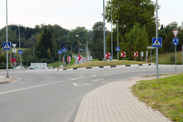 Small roundabout with traffic signs.