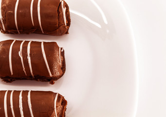 A fresh sweet cake called potato with chocolate is on a white plate