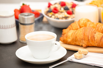 Breakfast Served in the morning with Hot black coffee and croissants Natural corn flake breakfast cereal in cups and fruit on the breakfast table every day