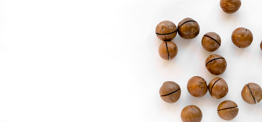 Macadamia nuts in the shell isolated on a white background close-up.
