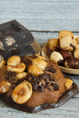 hazelnut and chocolate chip cookies close-up and chocolate pieces