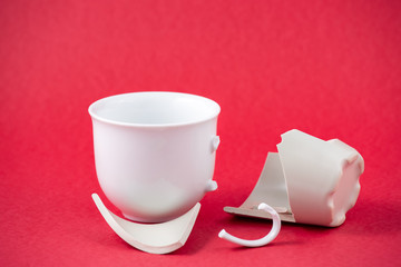 Broken Plate and dish or broken water glass on the on the red background The concept of accidents...