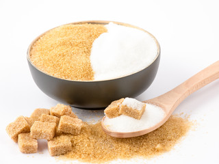 Brown sugar in a wooden bowl or wooden spoon Sugar for health Use for cooking or desserts on white and sugar backgrounds.