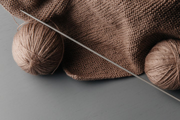 Winter needlework. Wool yarn balls for hand-knitting and knitting spokes on. The place for the...