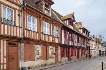 Fototapeta na wymiar Honfleur, France. Colorful half-timbered buildings on Bavole street