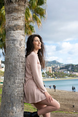 Young woman relaxing on the beach enjoying a nice sunny day