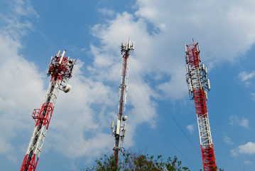 Cell Site Pole, Digital Telecommunication Antenna in Blue Sky Background.