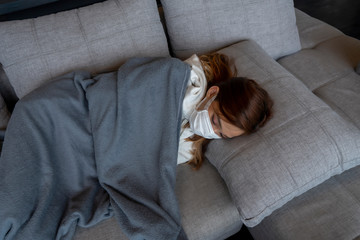 Foreground to the thermometer and the background of The Asian woman is sick. She is having a high fever.there is a high fever caused by an infection from the 19 Colonia Kovic virus, strain A.