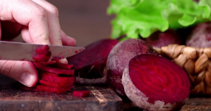 Sliced fresh beets on a cutting Board.