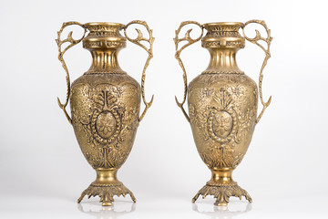 bronze vases on a white background, ancient jugs of bronze, bronze antique vases front view,...