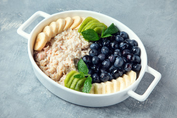 Oatmeal porridge with berries and fruit