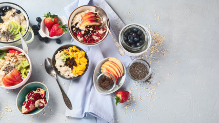Bowls of oatmeal with berries and fruits  for healthy breakfast. Food with vitamins, minerals and...