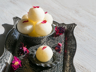 Close up Indian Rasgulla dessert. Sweet served in a bowl, top view