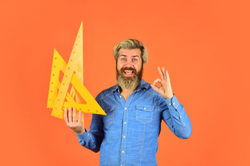 man teacher use triangle tool. bearded tutor man with ruler. draw and measure. back to school....