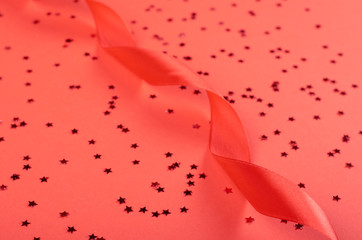 Decorative red ribbon flat lay.