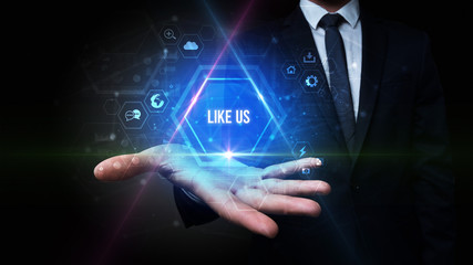 Man hand holding LIKE US inscription, social media concept