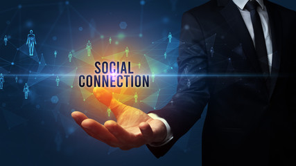 Elegant hand holding SOCIAL CONNECTION inscription, social networking concept