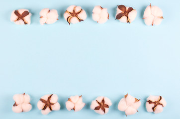 Cotton ball on blue background composition.