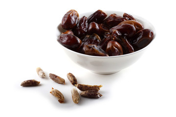 Date fruits on saucer isolated on white