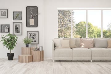 Minimalist living room in white color with sofa and summer landscape in window. Scandinavian interior design. 3D illustration