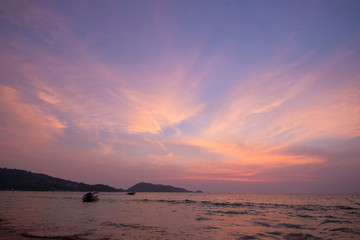 Stunning purple sunset on a tropical beach.