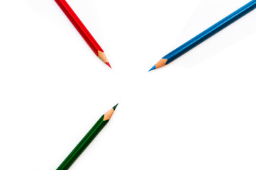 colored pencils point to the center of the frame on a white background and contains empty space for your text