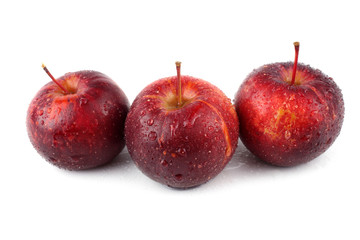 Three red little apples