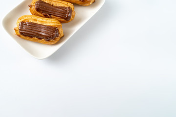 part cakes chocolate icing on white background