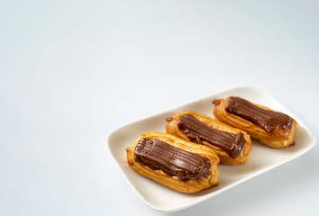 fragment cakes chocolate icing on white background