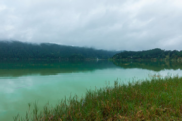 landscape with lake Furnas under the fog. tourist trip to sao miguel island, azores, portugal.