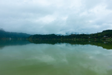 landscape with lake Furnas under the fog. tourist trip to sao miguel island, azores, portugal.
