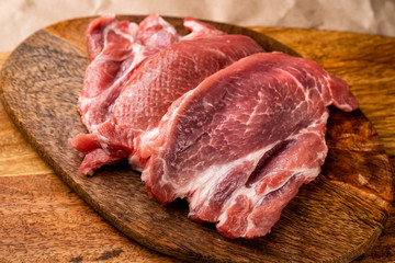 raw pork on wooden Board 
