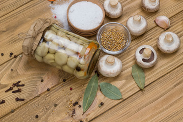 Fermentation Products. Glass jar with canned mushrooms. .