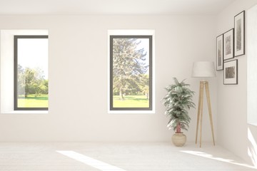 Stylish empty room in white color with summer landscape in window. Scandinavian interior design. 3D illustration