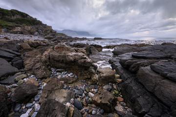 A beautiful moody seascape taken in hermanus, South Africa, on a stormy, cloudy morning.