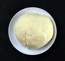  fresh baking dough lies on a plate