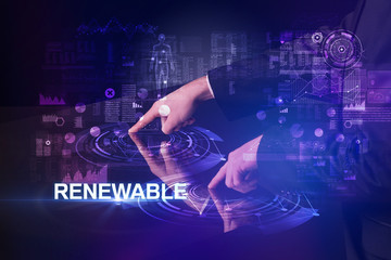 Businessman touching huge display with RENEWABLE inscription, modern technology concept