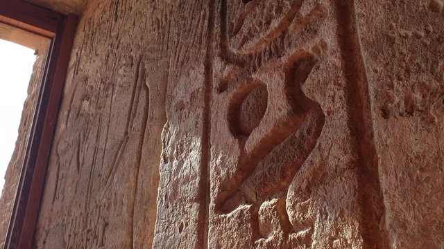 Close up shot Egypt hieroglyphics at Abu simble wall deep craven on sand stone