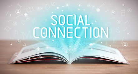 Open book with SOCIAL CONNECTION inscription, social media concept