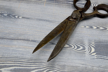 old scissors on wooden background