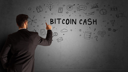 businessman drawing a creative idea sketch with BITCOIN CASH inscription, business strategy concept