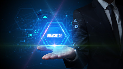 Man hand holding #HASHTAG inscription, social media concept