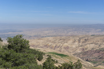 Fototapeta na wymiar Lush and green landscape on the hills around Mount Nebo near the Jordan Valley in the Spring. 