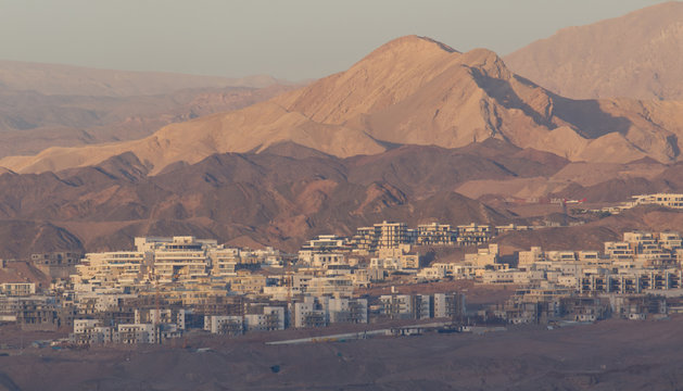 Landscape photograph of the suburb of Ayla in Aqaba in Jordan and the Gulf of Aqaba at sunrise