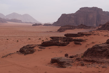 Fototapeta premium Landscape of a red sand dune in Wadi Rum in Jordan in the morning