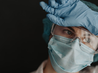 tired medical worker doctor after taking a large number of patients due to the epidemic of...