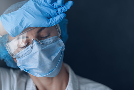 tired medical worker doctor after taking a large number of patients due to the epidemic of coronavirus